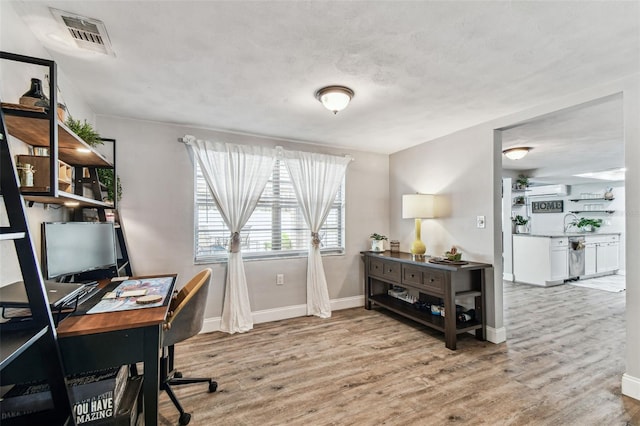 5744 Thrush Dr, New Port Richey, FL 34652 - home office with wood finished floors and baseboards