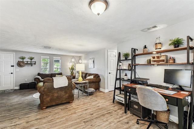 5744 Thrush Dr, New Port Richey, FL 34652 - living room with an office area and wood finished floors