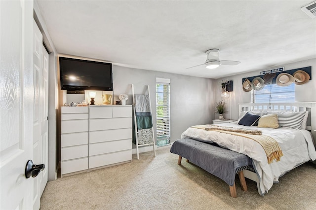 5744 Thrush Dr, New Port Richey, FL 34652 - bedroom featuring carpet floors and a ceiling fan