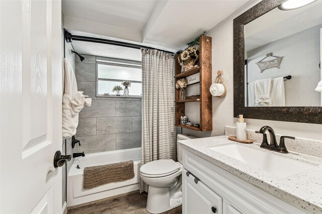 5744 Thrush Dr, New Port Richey, FL 34652 - full bath featuring vanity, shower / bath combo, and wood finished floors