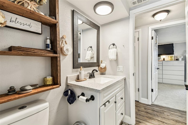 5744 Thrush Dr, New Port Richey, FL 34652 - bathroom featuring vanity and wood finished floors
