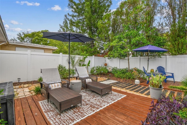 5744 Thrush Dr, New Port Richey, FL 34652 - wooden terrace featuring a fenced backyard and outdoor dining area