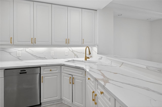 5430 Eagles Point Cir Unit 202, Sarasota, FL 34231 - kitchen featuring stainless steel dishwasher, white cabinets, and light stone counters
