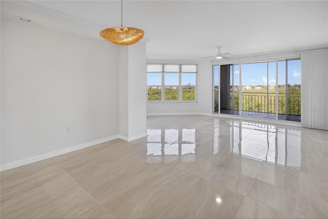 5430 Eagles Point Cir Unit 202, Sarasota, FL 34231 - empty room featuring baseboards and a ceiling fan