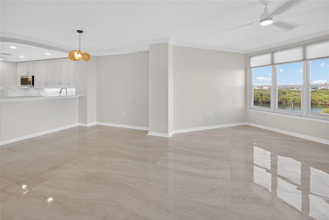 5430 Eagles Point Cir Unit 202, Sarasota, FL 34231 - unfurnished living room with a ceiling fan, ornamental molding, and recessed lighting