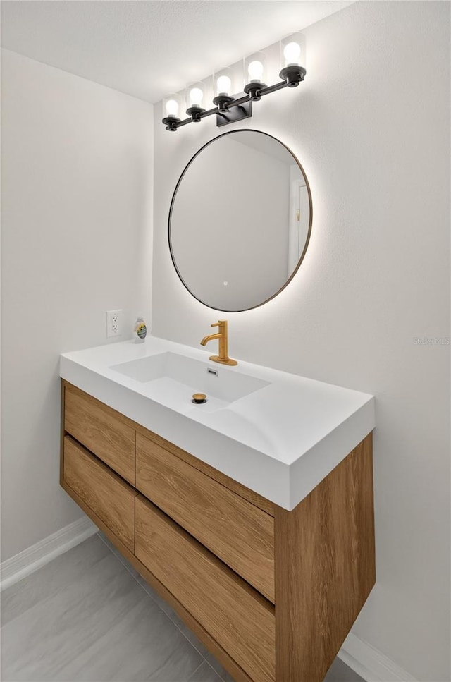 5430 Eagles Point Cir Unit 202, Sarasota, FL 34231 - bathroom featuring vanity and baseboards