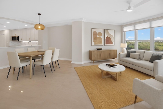 5430 Eagles Point Cir Unit 202, Sarasota, FL 34231 - living room featuring ornamental molding, a ceiling fan, recessed lighting, and light tile patterned flooring