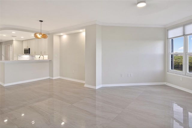 5430 Eagles Point Cir Unit 202, Sarasota, FL 34231 - unfurnished living room with crown molding and recessed lighting