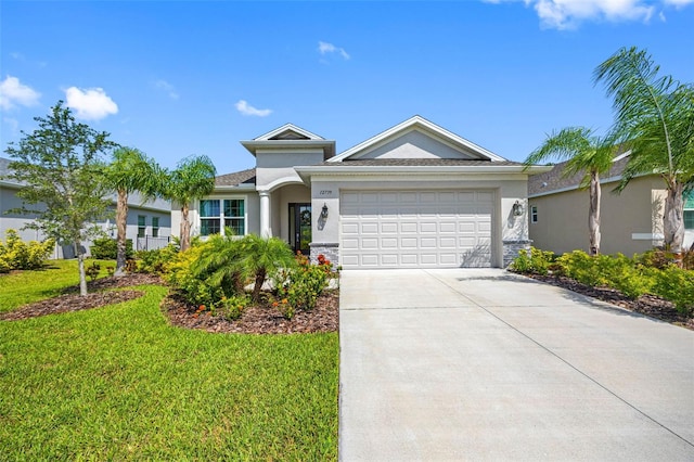 12739 Rainwashed Loop, Parrish, FL 34219 - ranch-style house featuring stucco siding, an attached garage, concrete driveway, and a front lawn