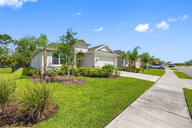 12739 Rainwashed Loop, Parrish, FL 34219 - ranch-style house with concrete driveway, stucco siding, and an attached garage