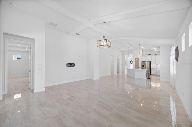 12739 Rainwashed Loop, Parrish, FL 34219 - unfurnished living room featuring a chandelier and baseboards