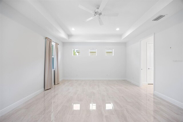 12739 Rainwashed Loop, Parrish, FL 34219 - empty room featuring a raised ceiling, ceiling fan, and recessed lighting
