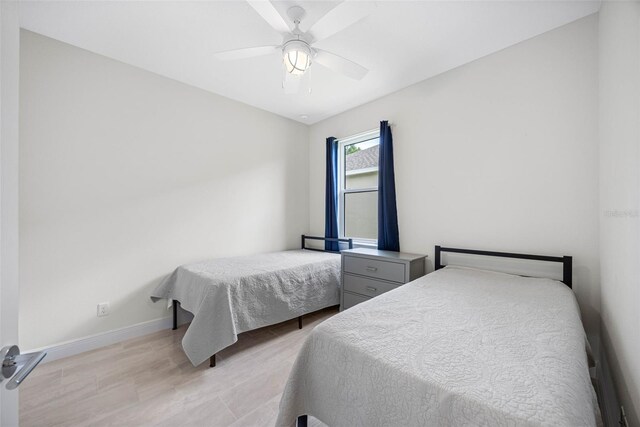 12739 Rainwashed Loop, Parrish, FL 34219 - bedroom with ceiling fan and light wood-type flooring