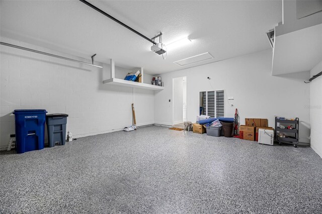 12739 Rainwashed Loop, Parrish, FL 34219 - garage with a garage door opener and concrete block wall