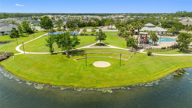 12739 Rainwashed Loop, Parrish, FL 34219 - aerial perspective of suburban area with a pool and a nearby body of water