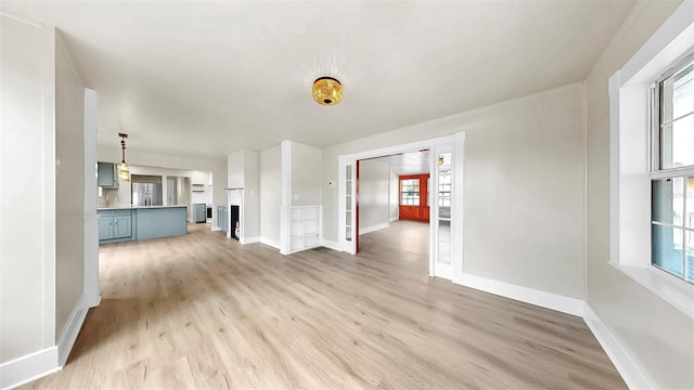 1005 45th St W, Bradenton, FL 34209 - unfurnished living room featuring light wood-style flooring