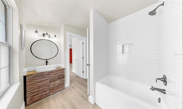 1005 45th St W, Bradenton, FL 34209 - full bathroom with tub / shower combination, wood finished floors, and vanity