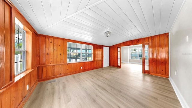 1005 45th St W, Bradenton, FL 34209 - empty room with wooden ceiling, light wood-style floors, and wooden walls