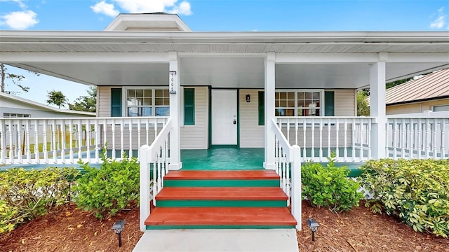 1005 45th St W, Bradenton, FL 34209 - view of exterior entry featuring a porch