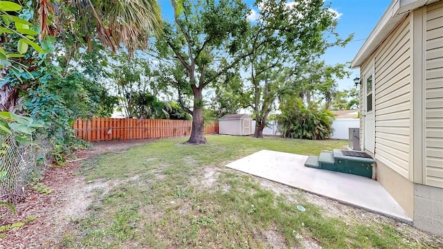 1005 45th St W, Bradenton, FL 34209 - fenced backyard featuring a storage unit and a patio area
