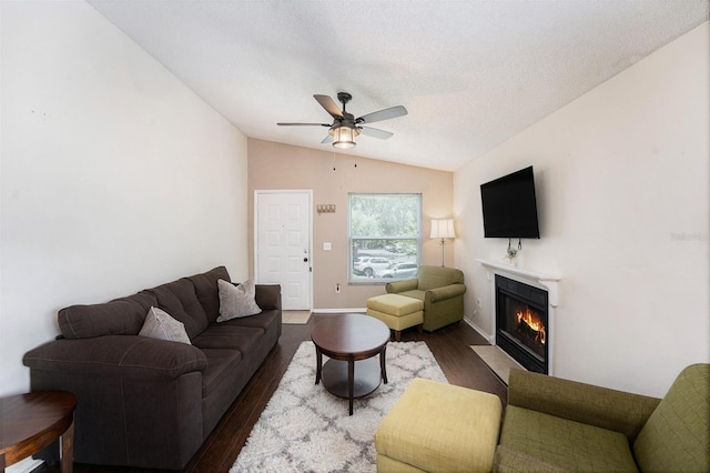 4014 Dream Oak Pl Unit 202, Tampa, FL 33613 - living room featuring lofted ceiling, a fireplace with flush hearth, dark wood finished floors, a ceiling fan, and a textured ceiling