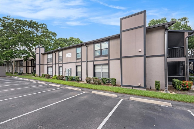 4014 Dream Oak Pl Unit 202, Tampa, FL 33613 - view of building exterior featuring uncovered parking