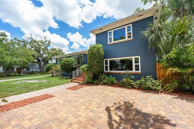 2819 N Central Ave, Tampa, FL 33602 - view of front of home featuring a patio and stucco siding