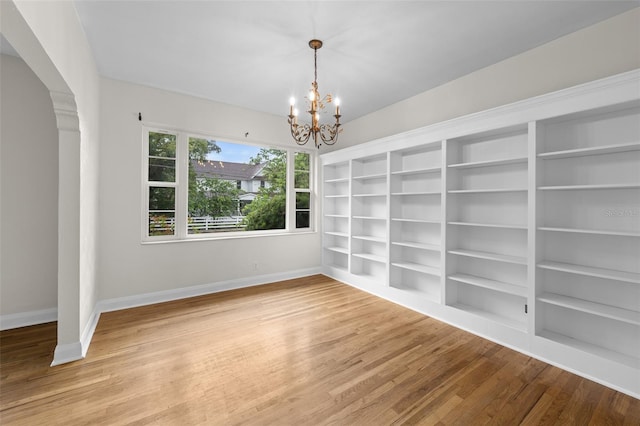 2819 N Central Ave, Tampa, FL 33602 - empty room featuring a chandelier, wood finished floors, and built in features