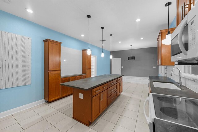 2819 N Central Ave, Tampa, FL 33602 - kitchen featuring white appliances, dark countertops, brown cabinets, a kitchen island, and decorative light fixtures