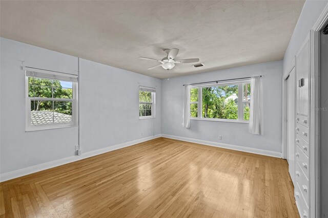 2819 N Central Ave, Tampa, FL 33602 - unfurnished bedroom featuring light wood-type flooring and ceiling fan