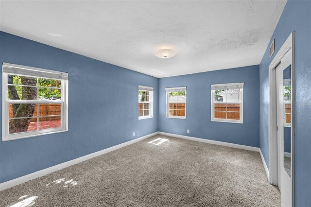 2819 N Central Ave, Tampa, FL 33602 - carpeted spare room featuring baseboards