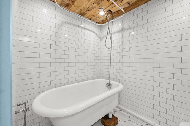 2819 N Central Ave, Tampa, FL 33602 - bathroom featuring wooden ceiling, tile walls, a freestanding bath, and a tile shower
