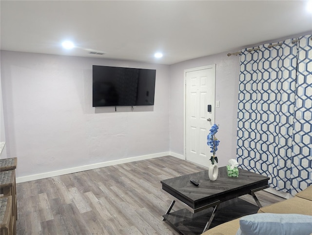 1028 E 93rd Ave Unit A, Tampa, FL 33612 - living room featuring wood finished floors and recessed lighting