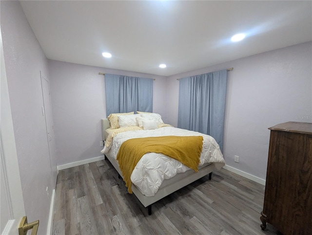 1028 E 93rd Ave Unit A, Tampa, FL 33612 - bedroom with wood finished floors and recessed lighting
