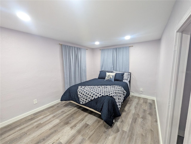 1028 E 93rd Ave Unit A, Tampa, FL 33612 - bedroom with wood finished floors and recessed lighting