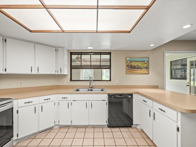 1015 Hastings Ct, Lutz, FL 33548 - kitchen with dishwasher, recessed lighting, a peninsula, light countertops, and white cabinetry
