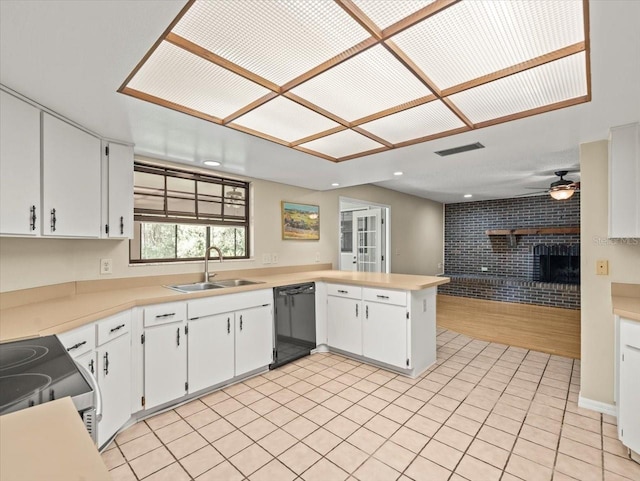 1015 Hastings Ct, Lutz, FL 33548 - kitchen with dishwasher, a brick fireplace, a ceiling fan, electric range, and light countertops