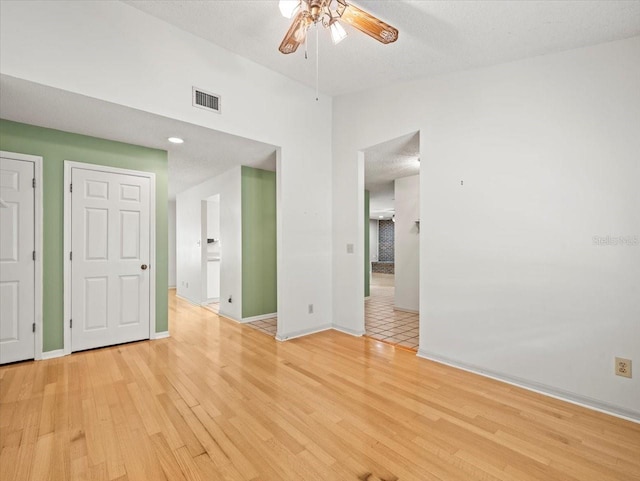 1015 Hastings Ct, Lutz, FL 33548 - unfurnished room with a ceiling fan and light wood-type flooring