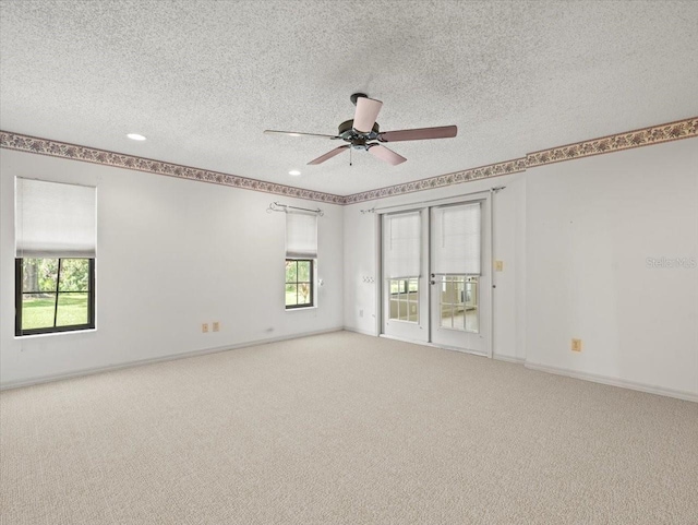 1015 Hastings Ct, Lutz, FL 33548 - carpeted spare room with healthy amount of natural light, a textured ceiling, a ceiling fan, and recessed lighting