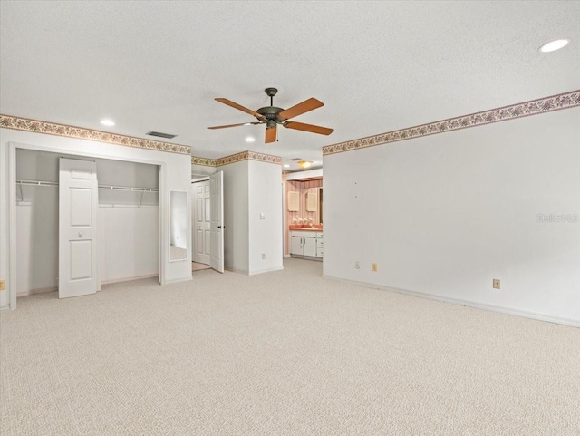 1015 Hastings Ct, Lutz, FL 33548 - unfurnished bedroom with light carpet, recessed lighting, multiple closets, and ceiling fan