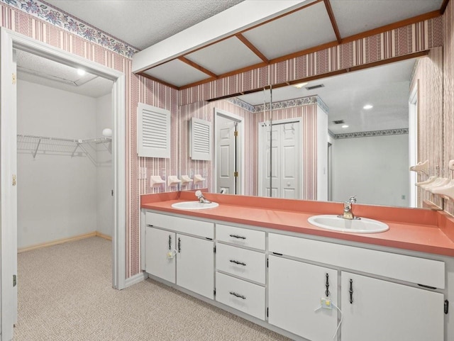 1015 Hastings Ct, Lutz, FL 33548 - bathroom featuring wallpapered walls, double vanity, and carpet flooring