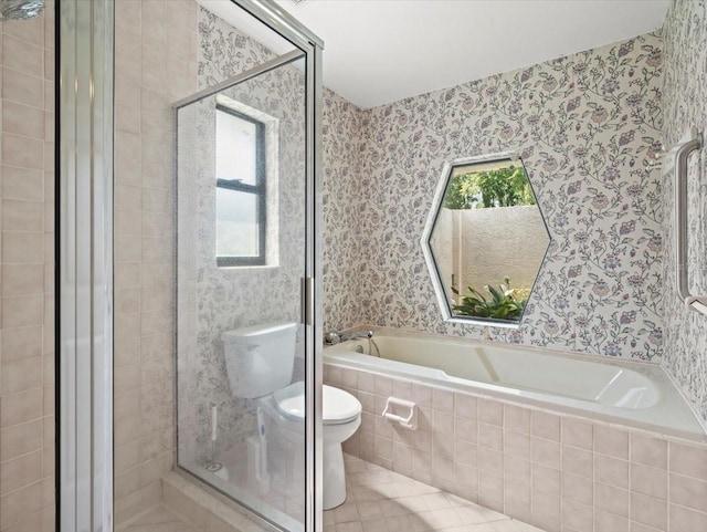 1015 Hastings Ct, Lutz, FL 33548 - bathroom with a garden tub, a stall shower, wallpapered walls, and tile patterned floors