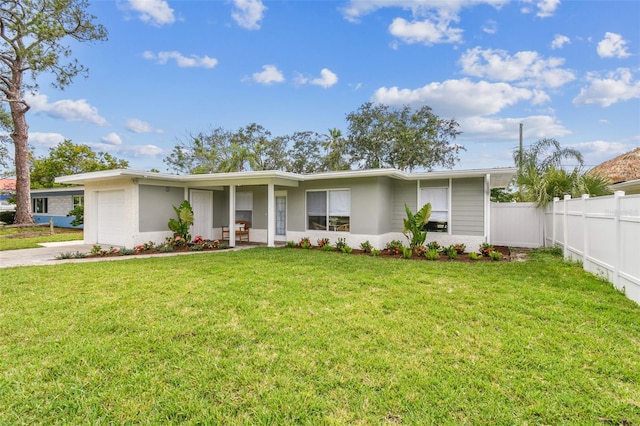 2452 Bayshore Blvd, Dunedin, FL 34698 - view of front of house featuring an attached garage and concrete driveway