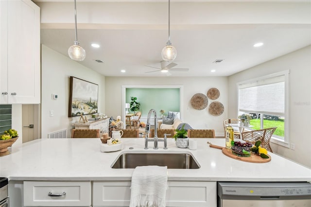 2452 Bayshore Blvd, Dunedin, FL 34698 - kitchen featuring stainless steel dishwasher, white cabinets, decorative light fixtures, a ceiling fan, and recessed lighting