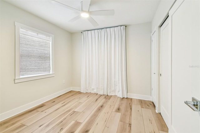 2452 Bayshore Blvd, Dunedin, FL 34698 - unfurnished bedroom with light wood finished floors, a closet, and ceiling fan