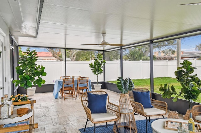 2452 Bayshore Blvd, Dunedin, FL 34698 - sunroom with ceiling fan and outdoor dining space