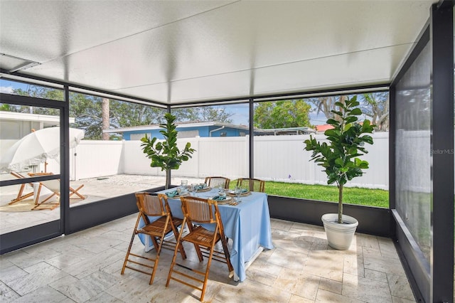 2452 Bayshore Blvd, Dunedin, FL 34698 - sunroom with outdoor dining area and healthy amount of natural light