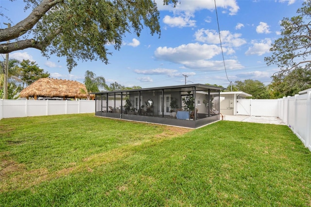 2452 Bayshore Blvd, Dunedin, FL 34698 - fenced backyard featuring a sunroom and a gate
