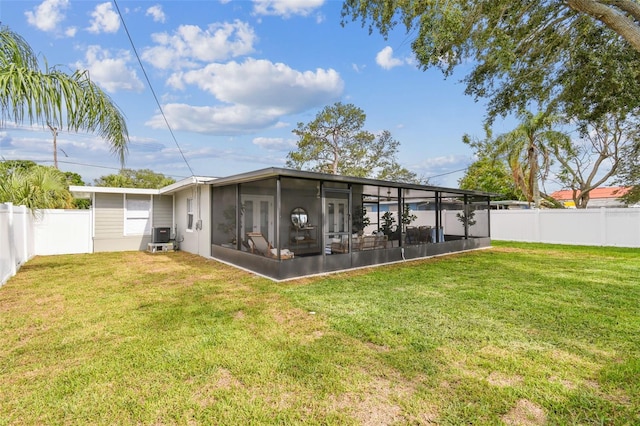 2452 Bayshore Blvd, Dunedin, FL 34698 - back of house with a sunroom and a fenced backyard