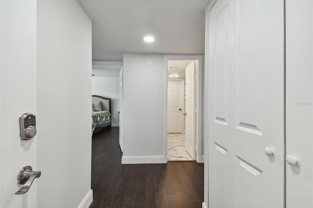 345 S Mcmullen Booth Rd Unit 142, Clearwater, FL 33759 - hall featuring dark wood-style flooring and baseboards
